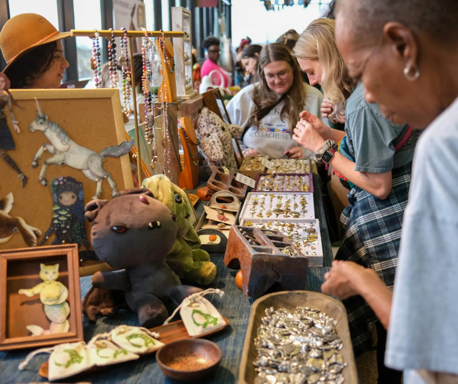 A group of antique shoppers perusing a festival