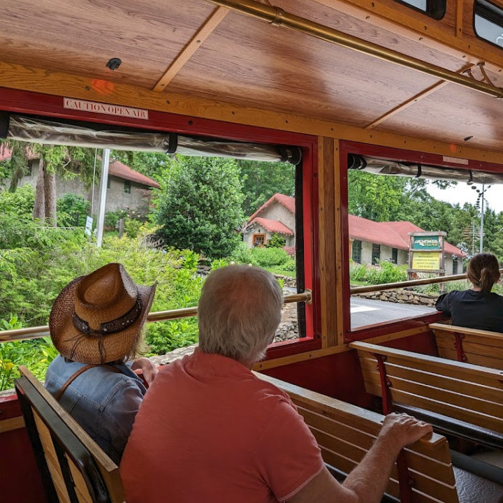 Elderly couple sitting on an older trolly